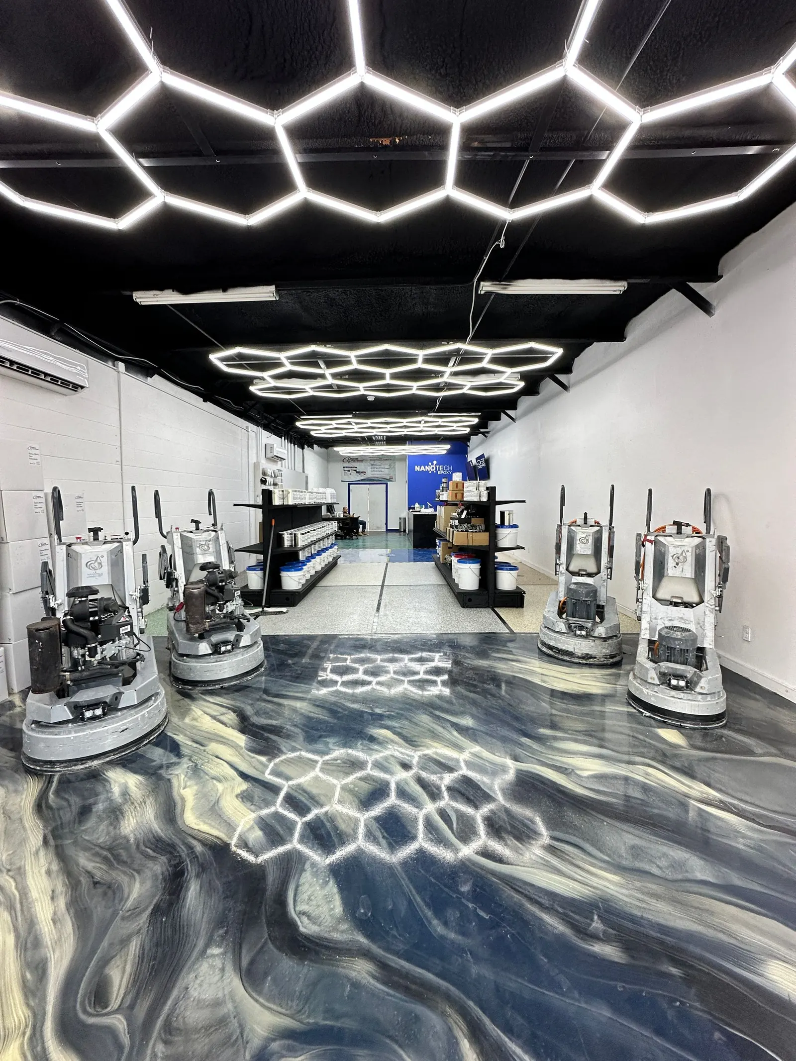 Metallic epoxy floor in a detailing studio