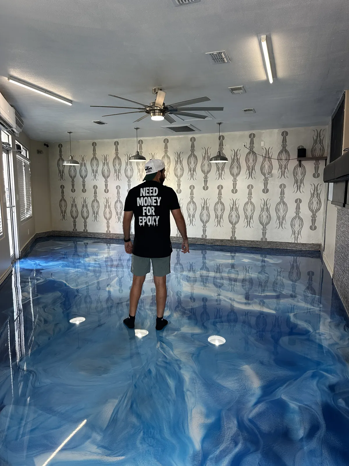 Blue metallic epoxy floor in a living room