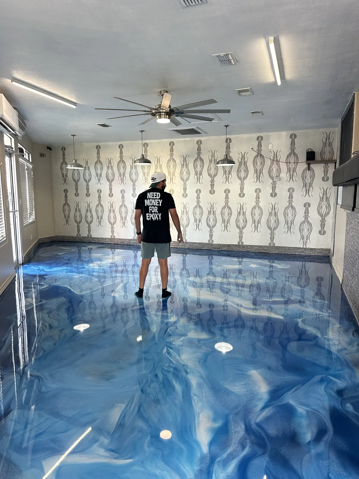 Blue metallic epoxy floor in a living room, view 2