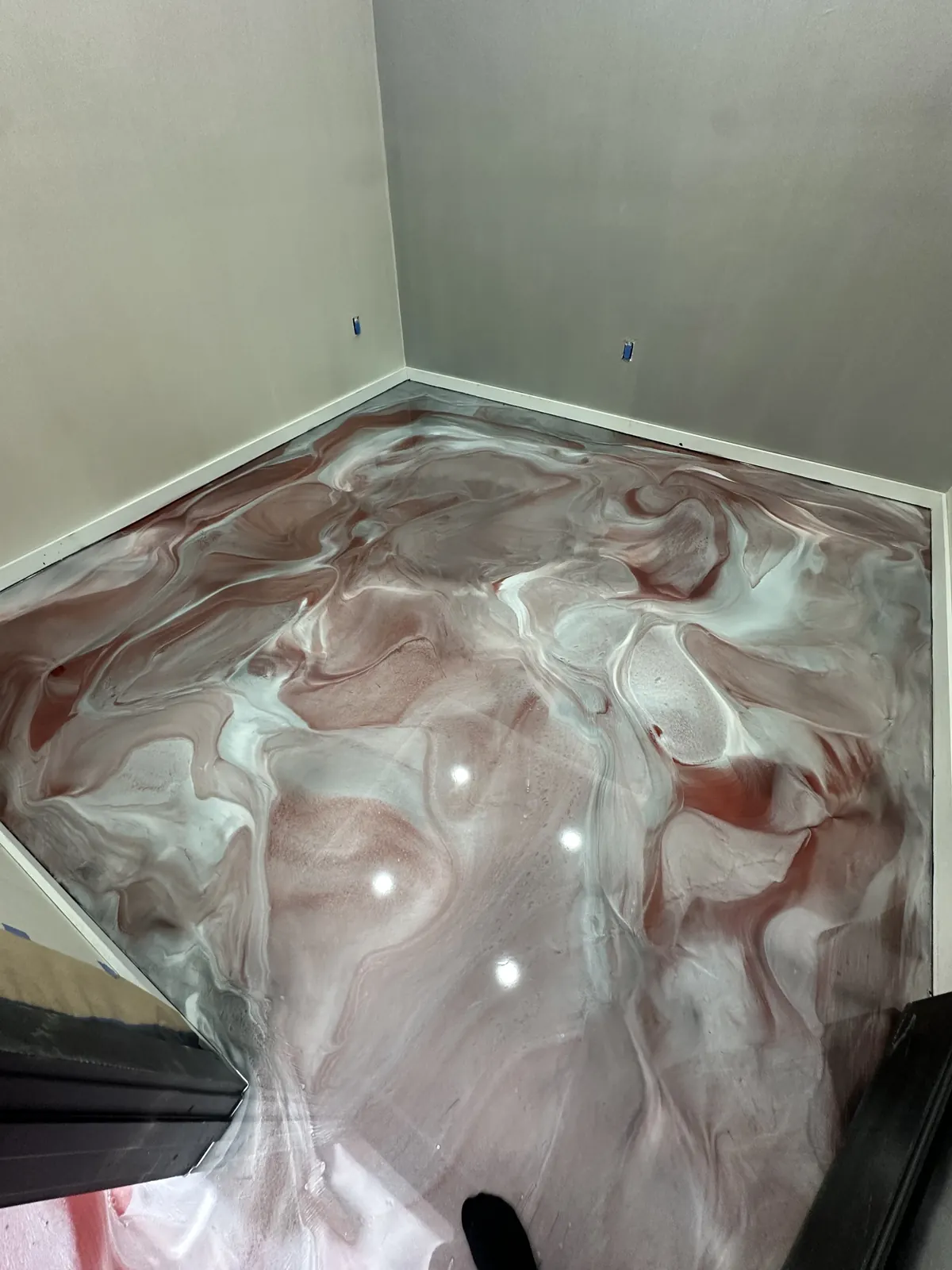 Red and silver metallic epoxy floor in an office hallway, view 6