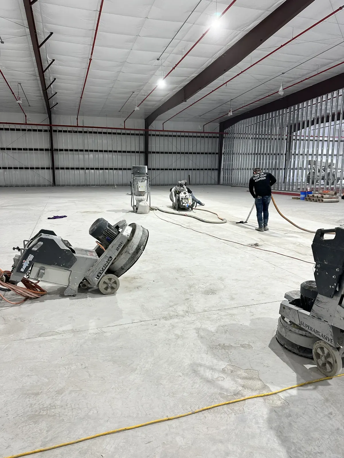 NanoTech Epoxy crew diamond grinding concrete before an epoxy installation
