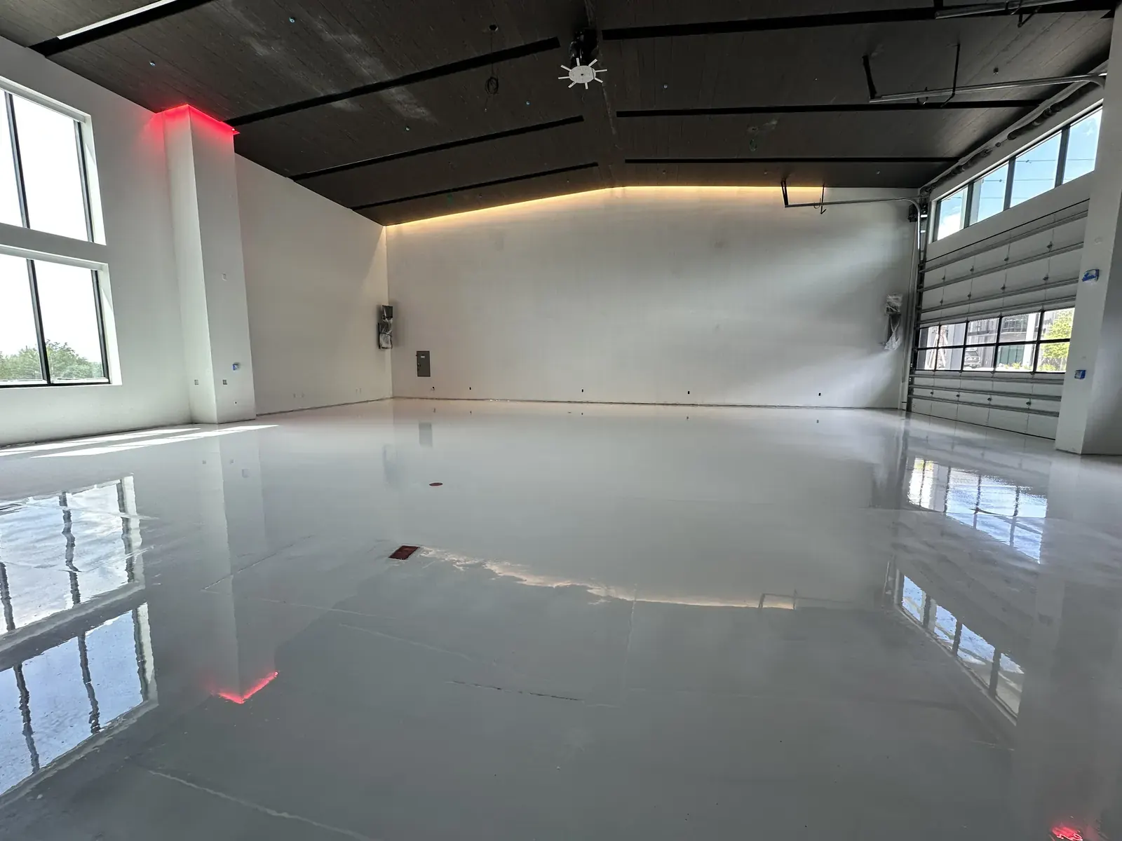 Light gray solid-color epoxy floor in a studio space, view 4